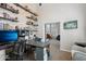 Spacious home office with built-in shelves and adjacent sitting room at 6901 W Tonto Dr, Glendale, AZ 85308