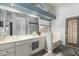 Bright bathroom features double sinks, a large mirror, soaking tub, and access to the backyard at 7344 E Lindner Cir, Mesa, AZ 85209