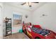 Cozy bedroom with a decorative car bed and natural light from the window at 7344 E Lindner Cir, Mesa, AZ 85209