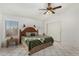 Relaxing main bedroom boasting a ceiling fan, and bright windows at 7344 E Lindner Cir, Mesa, AZ 85209