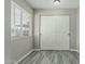 Bedroom featuring ample closet space and modern gray wood-look flooring at 7345 W Beryl Ave, Peoria, AZ 85345