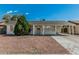 Single-story home with a covered carport and mature landscaping, offering curb appeal at 7345 W Beryl Ave, Peoria, AZ 85345