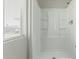 Bright shower stall, featuring white walls and a chrome faucet at 7345 W Beryl Ave, Peoria, AZ 85345