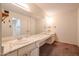 A spacious bathroom featuring a large mirror and dual sinks with ample counter space at 8329 E Keim Dr, Scottsdale, AZ 85250