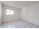 Bedroom featuring tile floors, a bright window offering natural light at 8329 E Keim Dr, Scottsdale, AZ 85250