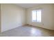 Cozy bedroom featuring tile floors and a bright window offering natural light at 8329 E Keim Dr, Scottsdale, AZ 85250