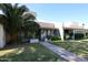 Street view of residential homes with desert landscaping and unique architectural details at 8329 E Keim Dr, Scottsdale, AZ 85250