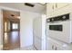 Bright kitchen with tile flooring, view into the living area, and white appliances at 8329 E Keim Dr, Scottsdale, AZ 85250