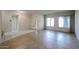 Spacious living room with tiled floors, large windows, and a bright, welcoming atmosphere at 8329 E Keim Dr, Scottsdale, AZ 85250