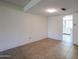 Living room with tile floors, neutral colors and a glimpse into the kitchen at 8329 E Keim Dr, Scottsdale, AZ 85250