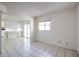 Open-concept living area adjacent to the kitchen with sliding door at 8329 E Keim Dr, Scottsdale, AZ 85250