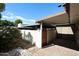 A covered patio and privacy wall create a secluded outdoor oasis in the backyard of this home at 8329 E Keim Dr, Scottsdale, AZ 85250