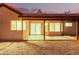 Cozy covered patio in a gravel backyard with stone pavers at 9009 E Sahuaro Dr, Scottsdale, AZ 85260