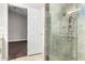 Bright bathroom featuring a glass-enclosed shower with stone surround at 9009 E Sahuaro Dr, Scottsdale, AZ 85260
