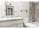 Bright bathroom featuring a stone countertop vanity, toilet, and shower/tub combo at 9009 E Sahuaro Dr, Scottsdale, AZ 85260