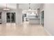 Open-concept living area flows into the well-lit kitchen with stainless steel appliances at 9009 E Sahuaro Dr, Scottsdale, AZ 85260