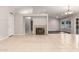 Spacious living room with tile flooring, recessed lighting, and stylish light fixtures at 9009 E Sahuaro Dr, Scottsdale, AZ 85260
