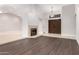 Spacious living room features vaulted ceilings, fireplace, and new hardwood floors at 9009 E Sahuaro Dr, Scottsdale, AZ 85260