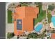 Aerial view of house featuring solar panels, pool, desert landscaping and clay tile roof at 10510 E Terra Dr, Scottsdale, AZ 85258