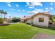 Expansive backyard with pool, patio, lush lawn, and charming desert landscape at 10510 E Terra Dr, Scottsdale, AZ 85258