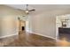 Bedroom with wood floors, a ceiling fan, vaulted ceiling, and open doorway to the bathroom at 10510 E Terra Dr, Scottsdale, AZ 85258