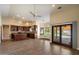 Open concept kitchen with custom wood cabinets, an island, stainless appliances and a view of the pool at 10510 E Terra Dr, Scottsdale, AZ 85258