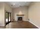 Bright, open living room featuring a cozy fireplace with tiled accents and sliding glass doors at 10510 E Terra Dr, Scottsdale, AZ 85258