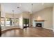 Inviting living room with a decorative fireplace, sliding glass doors and views of the pool at 10510 E Terra Dr, Scottsdale, AZ 85258