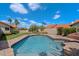 Sparkling pool surrounded by well-maintained lawn and desert landscaping, perfect for outdoor enjoyment at 10510 E Terra Dr, Scottsdale, AZ 85258