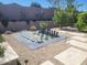 Unique backyard features a life-size chess set and attractive desert landscaping at 10694 E Firethorn Dr, Scottsdale, AZ 85255