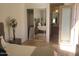Bright bedroom with mirrored closet, ensuite, and neutral decor at 10694 E Firethorn Dr, Scottsdale, AZ 85255