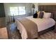 Bedroom with a plush bed, modern decor, and ample natural light, creating a serene and stylish retreat at 10694 E Firethorn Dr, Scottsdale, AZ 85255