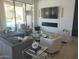 Bright living room boasts modern furnishings, fireplace, and pool views at 10694 E Firethorn Dr, Scottsdale, AZ 85255