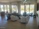 Open concept living room with access to the patio and pool at 10694 E Firethorn Dr, Scottsdale, AZ 85255
