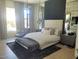 Serene main bedroom with a large bed, plush rug, and ample natural light at 10694 E Firethorn Dr, Scottsdale, AZ 85255