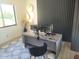 Office features a spacious desk with monitors, modern decor, and comfortable seating at 10694 E Firethorn Dr, Scottsdale, AZ 85255