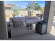 Outdoor kitchen with a built-in grill, ample counter space, and storage, perfect for al fresco dining at 10694 E Firethorn Dr, Scottsdale, AZ 85255