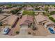 Expansive aerial view showcases the home's desert landscaping, tile roof, and proximity to the neighborhood park at 11004 E Delta Ave, Mesa, AZ 85208