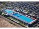 Aerial view of community pools, amenities, and parking, with convenient access for all residents and guests to the aquatic center at 11004 E Delta Ave, Mesa, AZ 85208