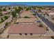Aerial view of home in a desert community with mountain views in the background at 11004 E Delta Ave, Mesa, AZ 85208