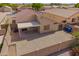 Aerial view of backyard featuring a patio and gravel landscaping with a privacy wall at 11004 E Delta Ave, Mesa, AZ 85208