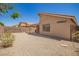 Backyard with desert landscaping and private block fence, providing a secure and secluded outdoor space at 11004 E Delta Ave, Mesa, AZ 85208