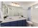 Bathroom featuring a double sink vanity, tub with shower, and modern fixtures at 11004 E Delta Ave, Mesa, AZ 85208