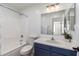 Bathroom features a tub with shower and a single sink vanity at 11004 E Delta Ave, Mesa, AZ 85208