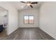 Bright bedroom with hardwood flooring, ceiling fan and window view at 11004 E Delta Ave, Mesa, AZ 85208