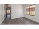 Neutral dining room area with hardwood floors, and a window with natural light at 11004 E Delta Ave, Mesa, AZ 85208