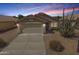 Charming single-story home featuring a two-car garage, low maintenance landscaping, and a beautiful Southwest-style desert view at 11004 E Delta Ave, Mesa, AZ 85208