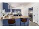 Open kitchen with breakfast bar, stainless steel appliances and view of dining area at 11004 E Delta Ave, Mesa, AZ 85208