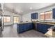 Open kitchen with granite countertops, stainless steel appliances, and hardwood floors at 11004 E Delta Ave, Mesa, AZ 85208