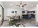 The kitchen has stainless steel appliances, granite countertops, and an island with barstool seating at 11004 E Delta Ave, Mesa, AZ 85208